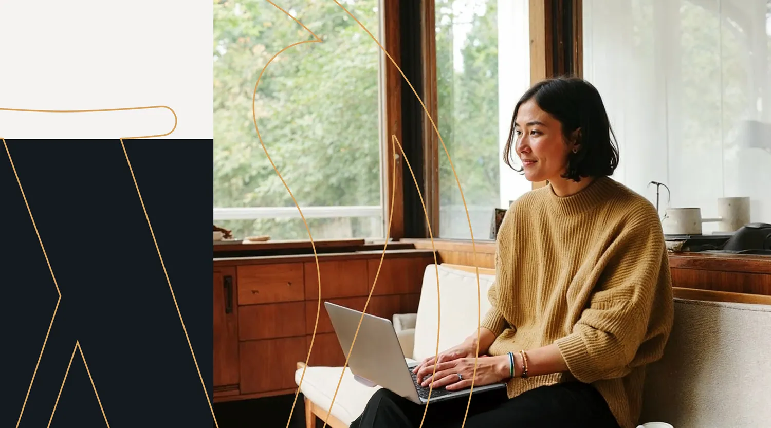 A woman in a cozy tan sweater sits on a modern bench, smiling while working on her laptop in a sunlit room with large windows and wooden interiors. WordPress gold logo line graphics overlay the image, adding a creative and dynamic design element.