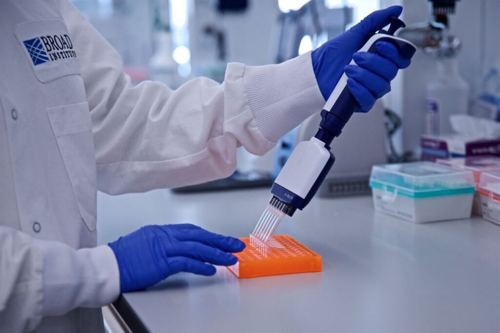 Person uses tool in a lab