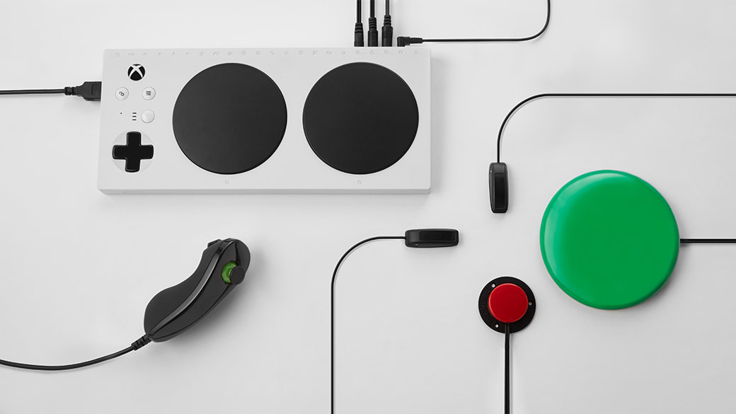 Top down view of the XBOX Adaptive Controller with added accessories connected to the controller.