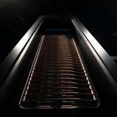 A close-up view of a server rack with multiple Nvidia hardware components stacked vertically.