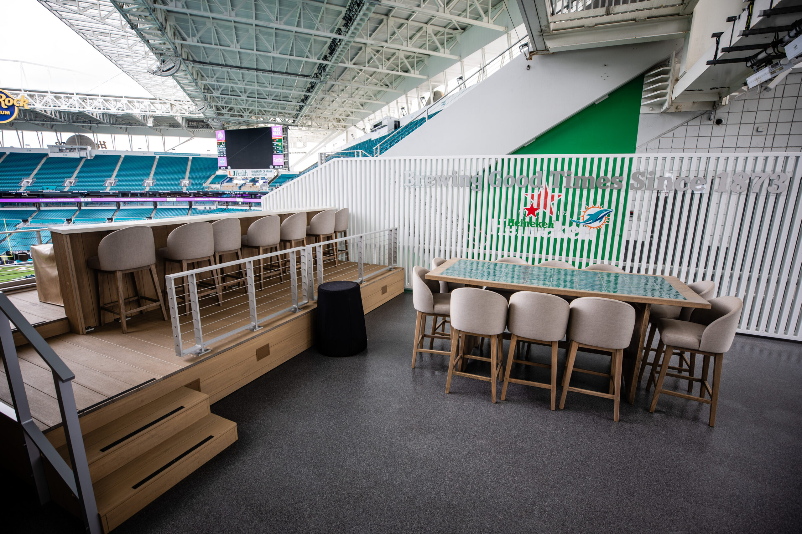 Terrace Suite Spectators enjoy food and beverage from a Bodega suite at a Dolphins game.